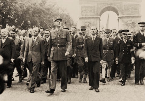 General_Charles_de_Gaulle_and_his_entourage_set_off_from_the_Arc_de_Triumphe_down_the_Champs_Elysees